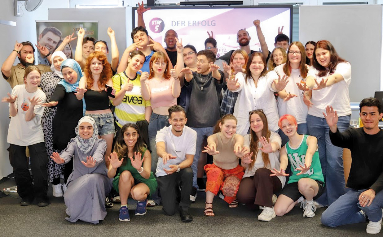 Gruppe mit Motivationstrainer